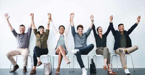 People with raised hands celebrating award for Atlantic Law Firm of the Year